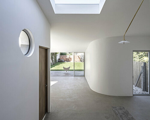 lines & curves engage in visual play within berenice curt's minimalist renovation in france