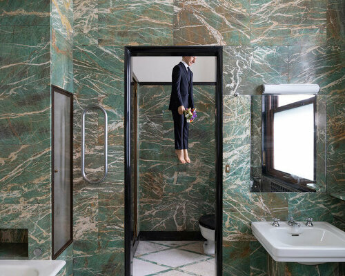 a self-portrait by maurizio cattelan hangs in the bathroom of milan's massimo de carlo gallery