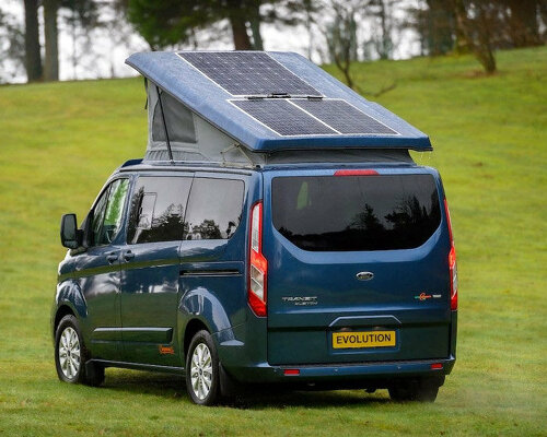 solar panels charge the new spacious ford camper, making it fully electric