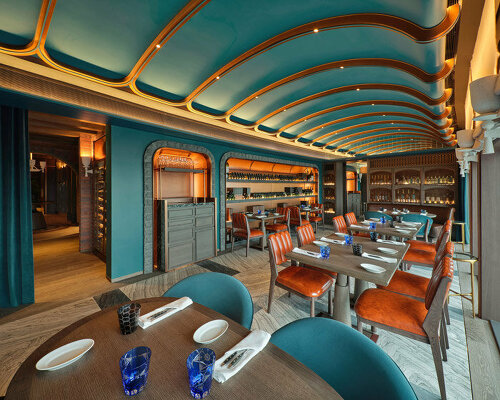 sky-high ‘the cellar’ by andré fu studio seats 28 diners and holds 400 premium wine labels