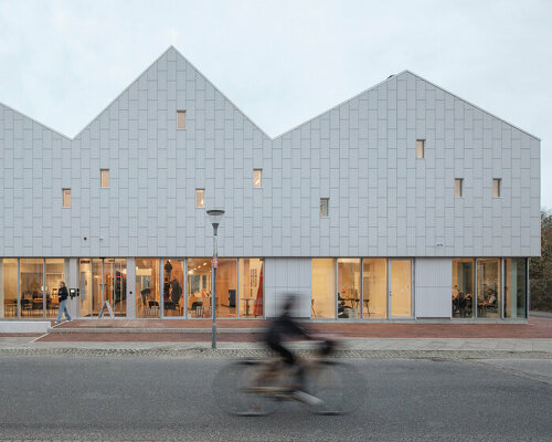 christensen & co. architects tops this viby library with a minimalist row of danish rooftops