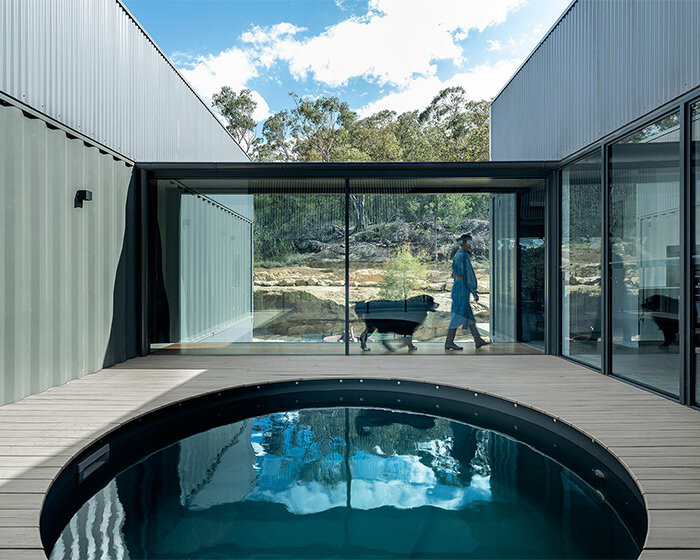 benn and penna architects wraps shipping container house around circular pool in australia