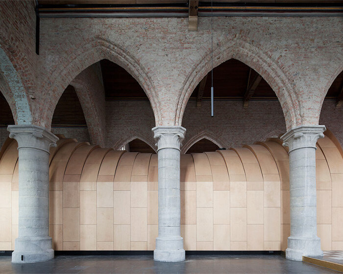 dhooge & meganck installs wooden 'house of silence' within renovated church in belgium