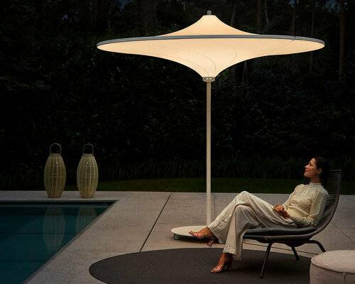 belgium-designed hulasol is a sun umbrella by day and an outdoor lamp by night