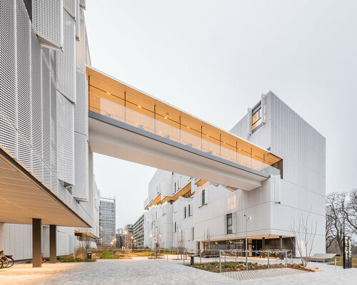 kengo kuma carves community space into grand morillon dorm like a calligraphy stroke