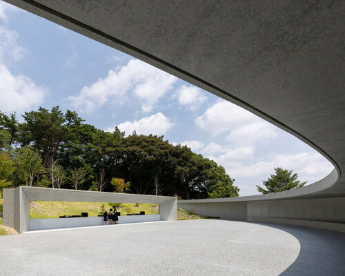 KINO architects completes japanese cemetery with arc-shaped plaza for contemplation