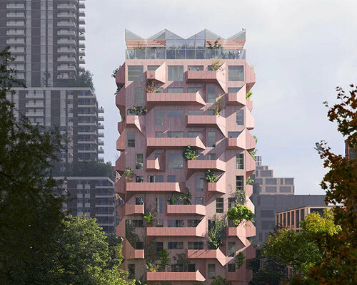 sculptural pink residential proposal rises proudly amid the urban fabric of amsterdam