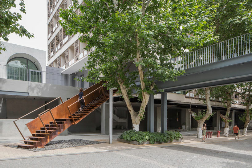 atelier diameter adds arch motifs to sculptural art gallery extension in nanjing, china