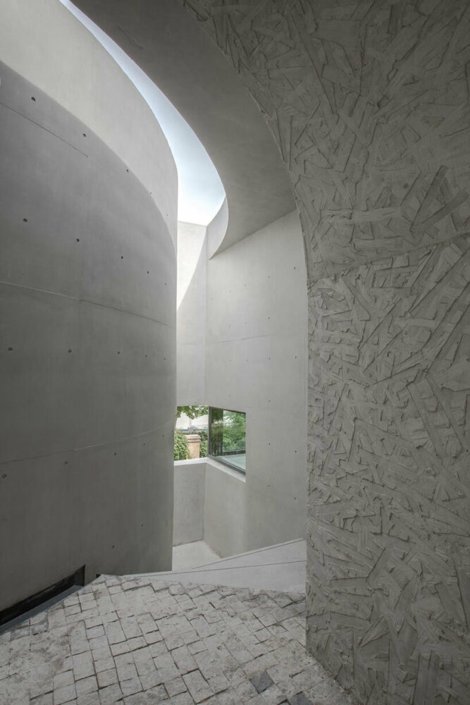 atelier diameter adds arch motifs to sculptural art gallery extension in nanjing, china