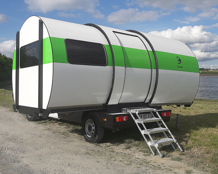 the beauer 3XC camper is a tiny can-shaped trailer that expands to triple its size