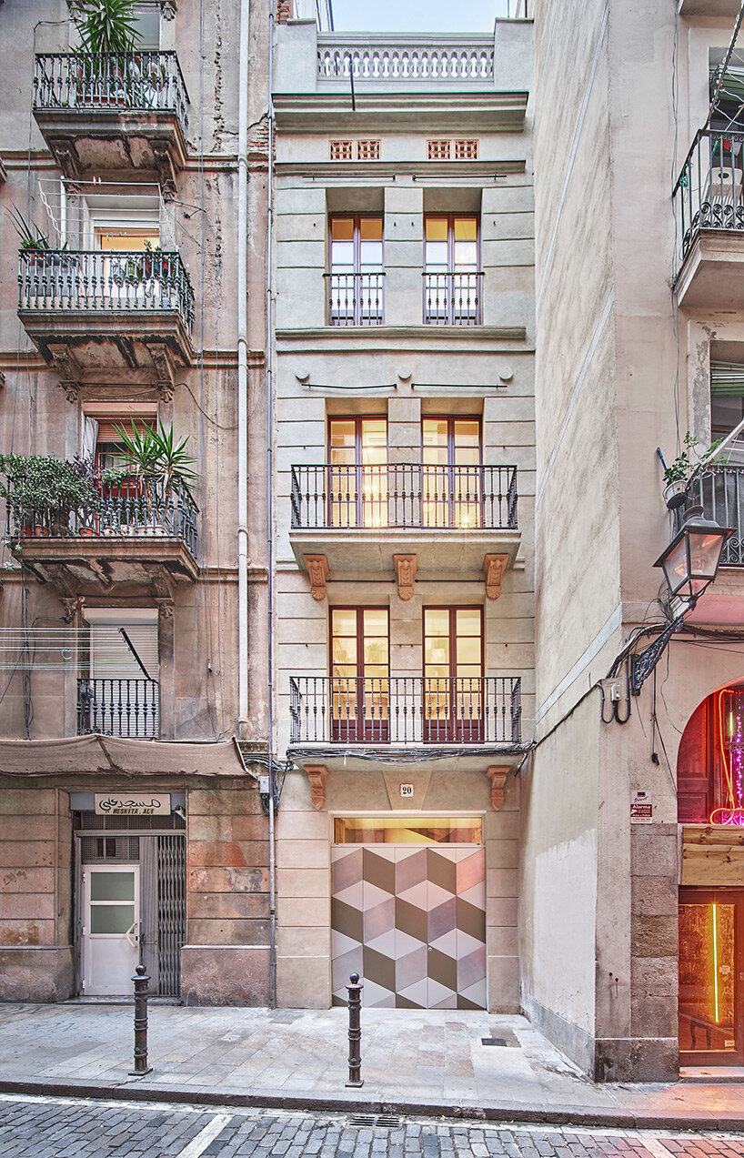 raúl sánchez installs brass kitchen to brick residential interior in  barcelona