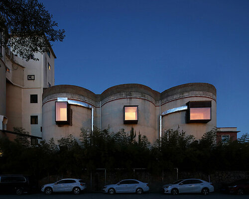 wanmu shazi converts old cement factory into meditative hub for creatives in china