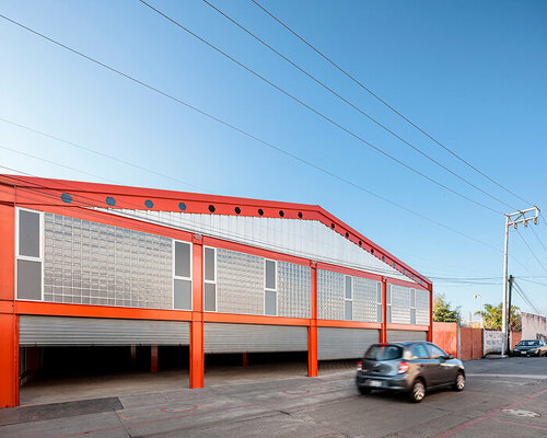 bright orange coating outlines this steel warehouse in morelia, mexico