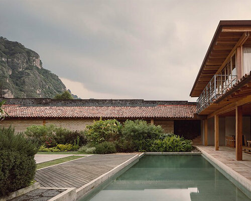 central garden of getaway home frames mountainous mexican surroundings