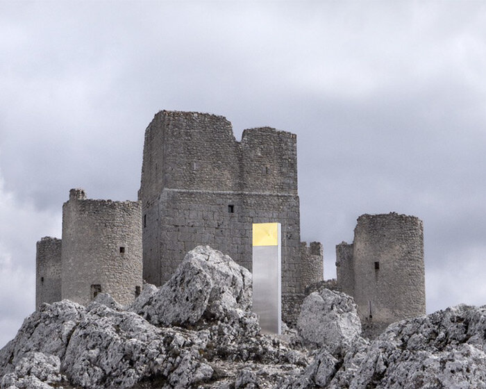 kinetic mirror totem by edoardo dionea cicconi distorts medieval fort surroundings in italy