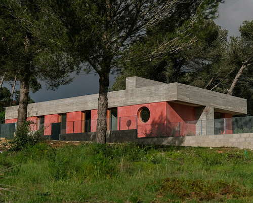 pink 'untitled' concrete house unfolds in the portuguese landscape