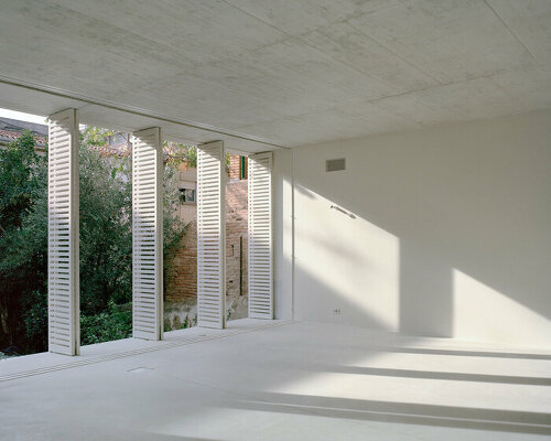 arquitectura-G preserves an historic barcelona facade with its 'casa verdi' renovation