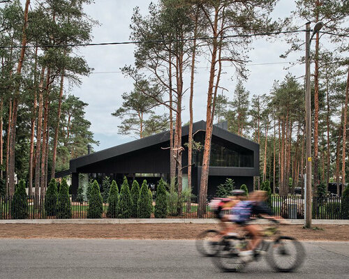 AZIA arhitektid nestles 'a house for a family and bikes' into pine forest outside of tallinn