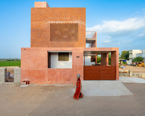 brick perforations and diverse cutouts characterize this family house in india