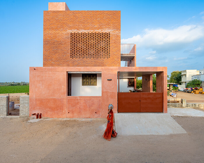 brick perforations and diverse cutouts characterize this family house in india