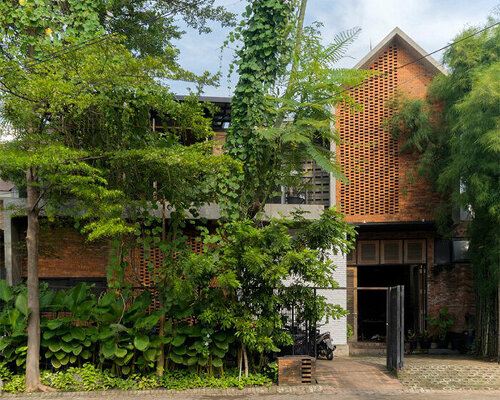 bamboo 'breathing walls' draw natural light in andyrahman's biophilic workspace in indonesia