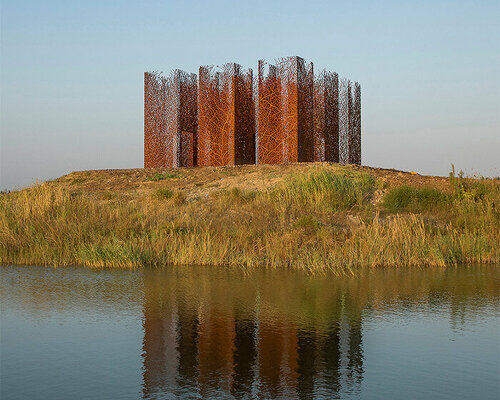 sprawling corten vine installation creates surreal nostalgic scene in chinese wetland