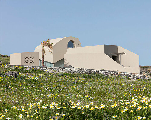 volcanic rock-like forms and earthy tones build kapsimalis architects' house in santorini