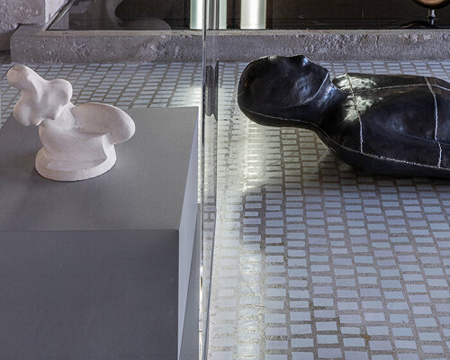 lucio fontanta and antony gormley's sculptures meet inside carlo scarpa's negozio olivetti in venice