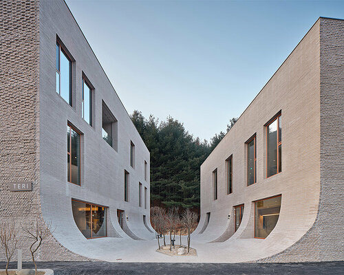 concrete brick façades flow into central yard to form nameless architecture's café in korea