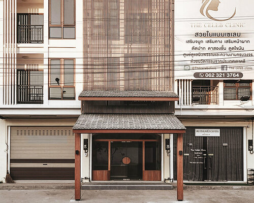 wood and terracotta shape this two-part facade design in thailand