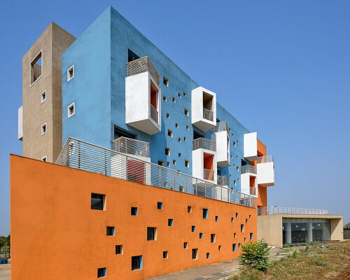 vibrant colors and boxy balconies make this housing project in india pop