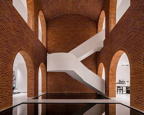 sculptural staircase meanders within giorio casa store in china