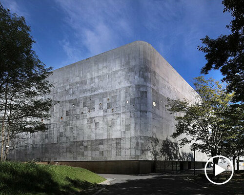 small and large holes peek through brutalist high school gymnasium in japan