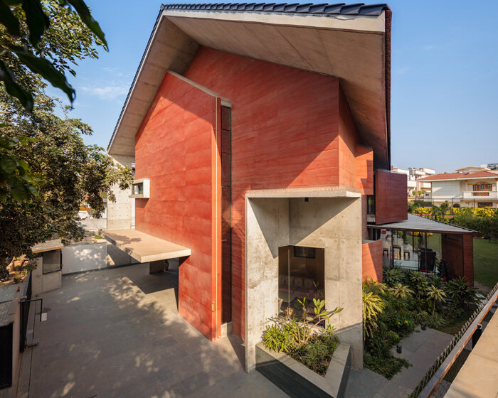 anagram architects infuses red concrete house in india with whimsical playfulness