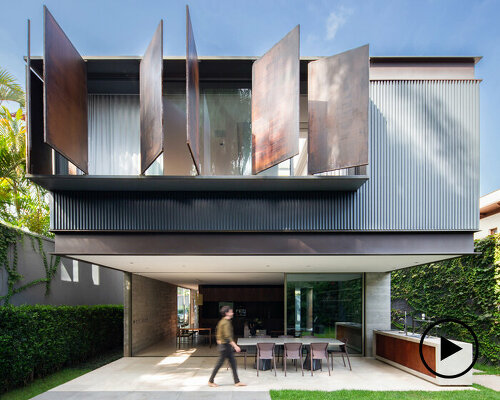 operable metal panels afford both privacy and openness for bento house in brazil