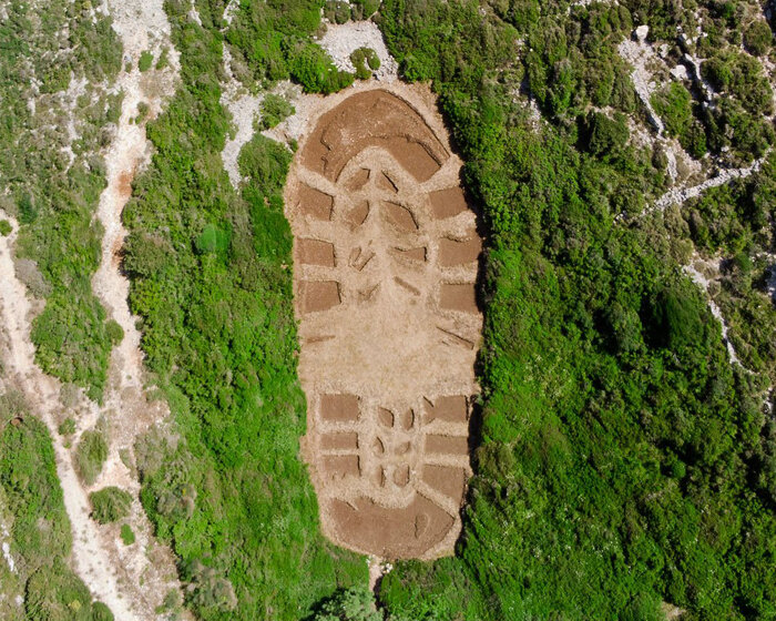 this 1,000 sqm land art in greece echoes humanity’s destructive ecological footprint