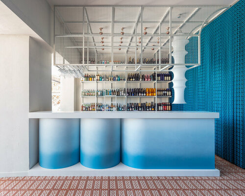 a gradient blue cocktail bar reflects the mediterranean in sperlonga, italy