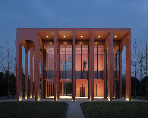 MUDA-architects adds red concrete arcades to tourist center in china