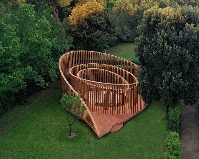 spiral wooden pavilion invites visitors to a sensory and playful experience