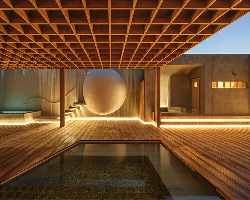 spherical saunas and indirect lighting evoke tranquility within kubo tsushima's spa in japan