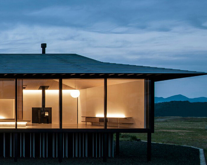 standing on stilts, this house blends japanese sensibilities with modern aesthetics