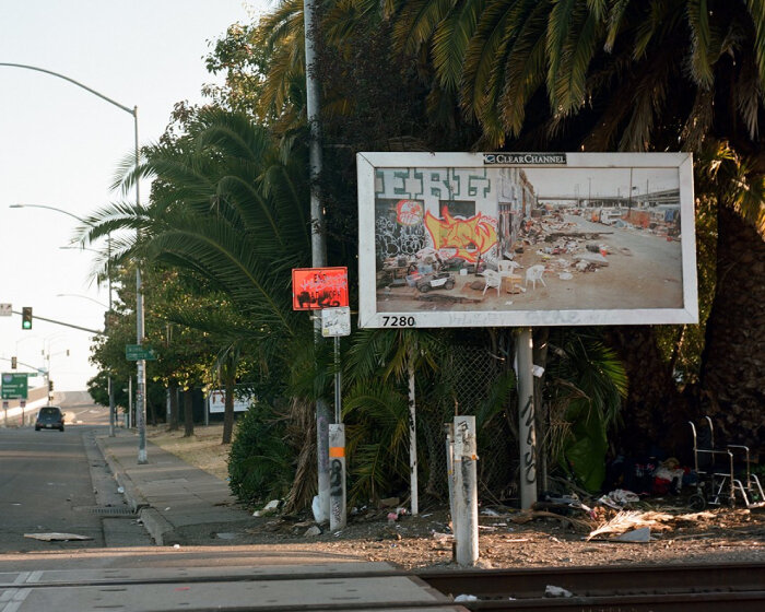 photographer puts up billboards to show drought, homelessness, and wildfires in california