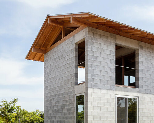 KKAA YTAA tops concrete block 'house of joy' with warm timber roof in japan