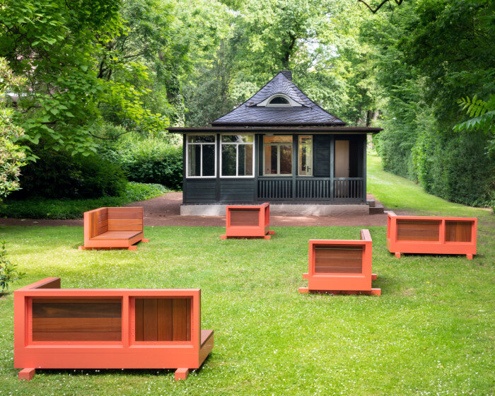 andrea zittel created five bench sculptures in soft red to gather people at esters garden house