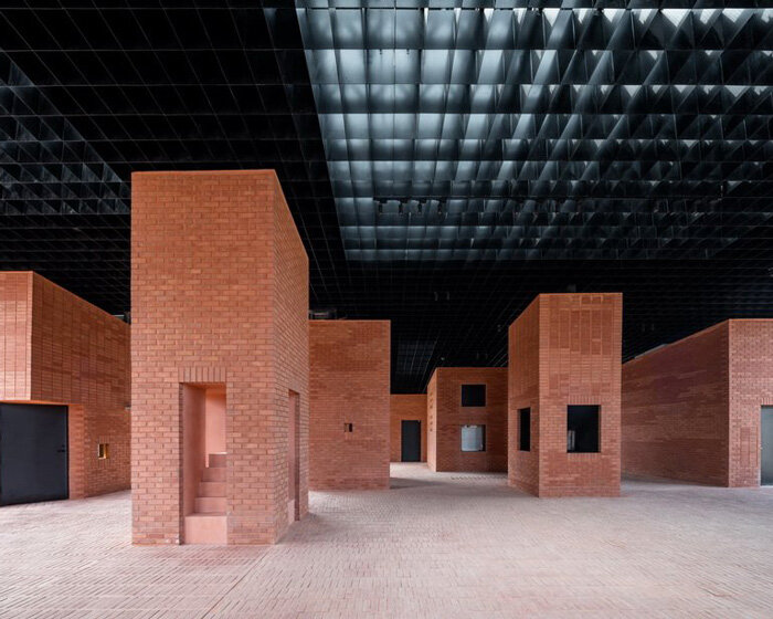 art center of aranya's monolithic brick pavilions offer fragmented views of china's mountains