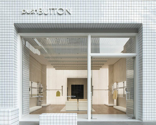 fei design's pushBUTTON store in china is wrapped in a monochrome geometric facade