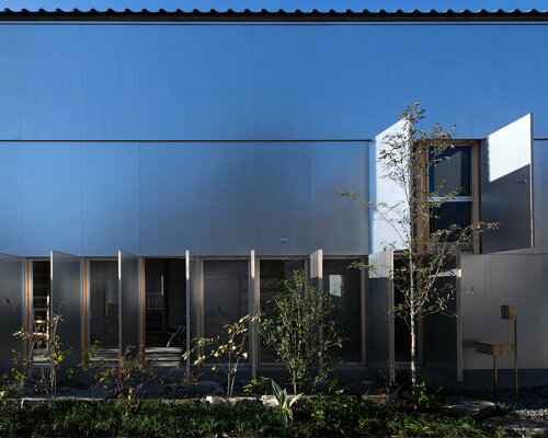 operable silver facade wraps japanese wooden house by seiichi yamada & associates