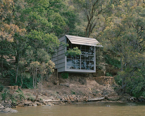 leopold banchini's off-grid cabin in australia is made of repurposed electrical posts