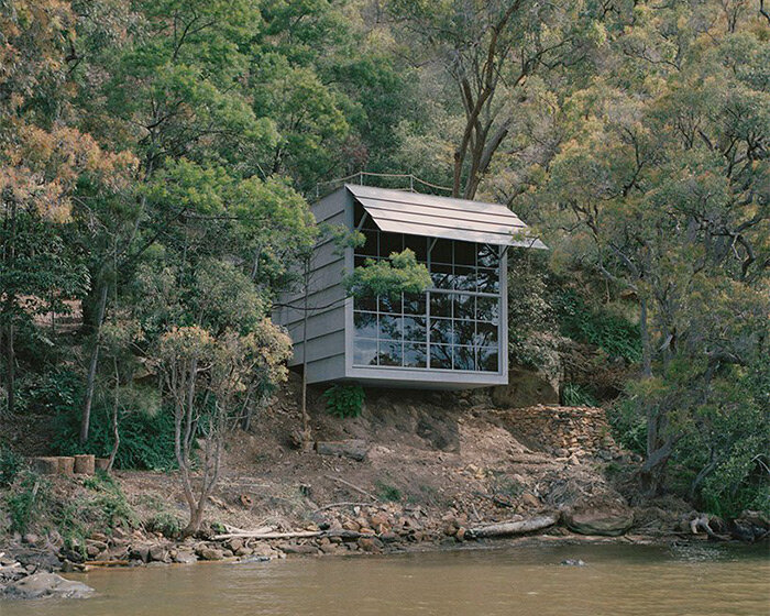 leopold banchini's off-grid cabin in australia is made of repurposed electrical posts