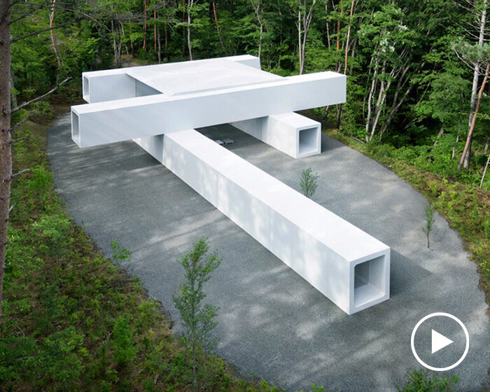 nendo stacks precast concrete culverts to create a minimalist guesthouse in japan